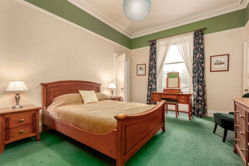 The generous-sized principal bedroom comes with an en-suite shower room.