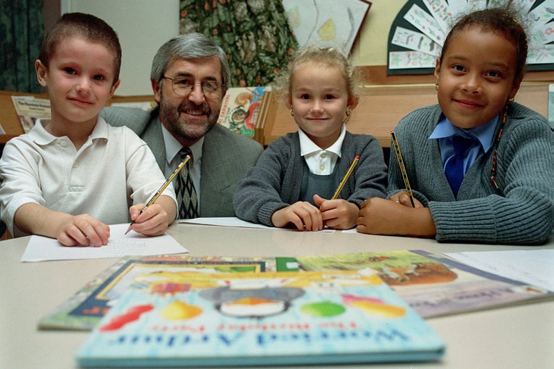 Pupils and headteacher Eric Whitehouse were all smiles in October 1999 after the school received a glowing Ofsted report Pictured, from left, are Jack Doyle, headteacher Eric Whitehouse, Lucy Smith and Hollie Holdsworth-Watson. 