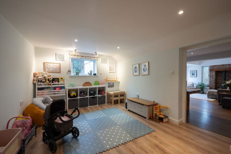 This handy family room is the perfect space for the kids to play in peace.