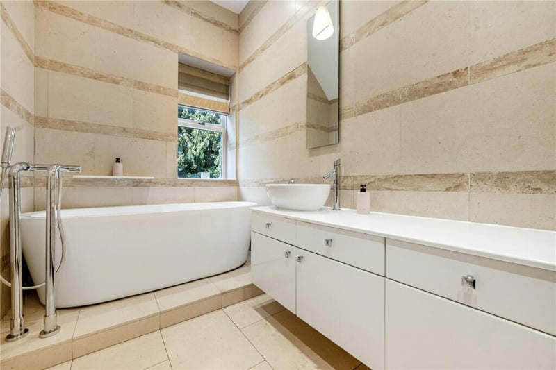 It has a luxurious en-suite with a stunning bath.