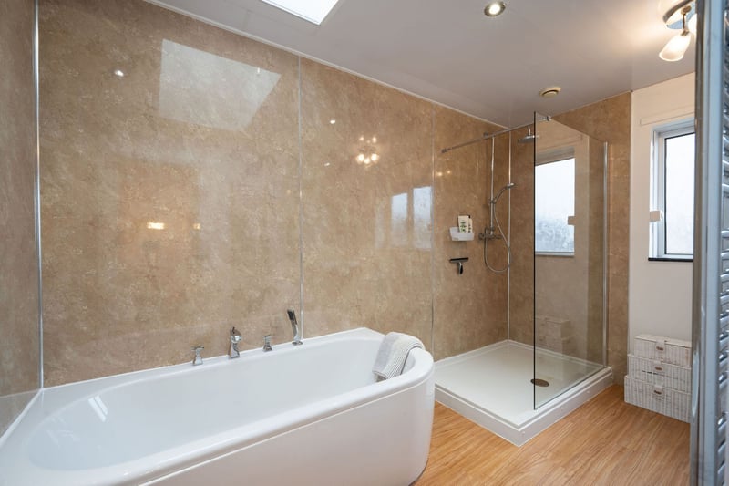 The family bathroom with bath and separate shower is situated on the first floor.