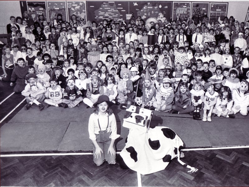 Dore School pupils show that they are in the mood for laughs as they all line up in fancy dress for Comic Relief in 1988