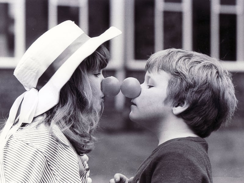 Helen Clarke (8) and Darren Hague (6) come nose to nose at Woodthorpe School in March 1989 for Red Nose Day