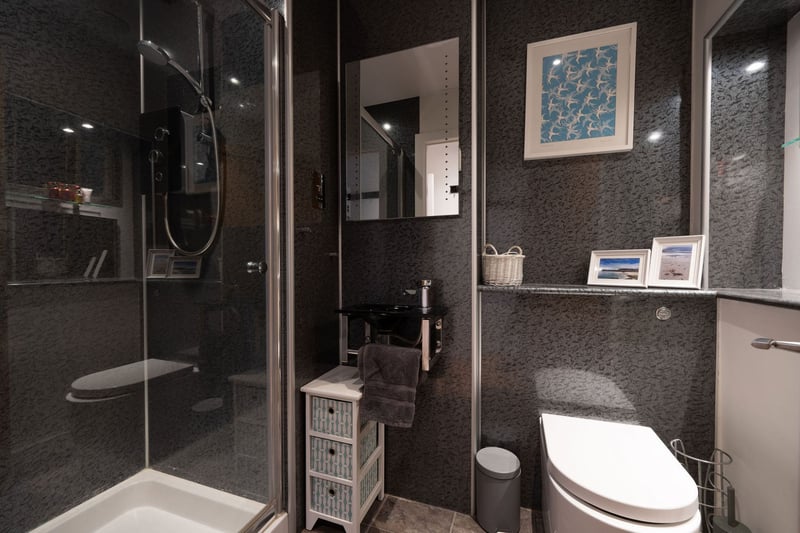 The modern en-suite shower room for the property's second bedroom.