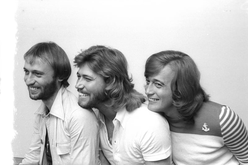 Brothers Barry, Robin, and Maurice Gibb, known collectively as The Bee Gees, were instrumental in defining the disco era with hits like "Stayin' Alive" and "How Deep Is Your Love."