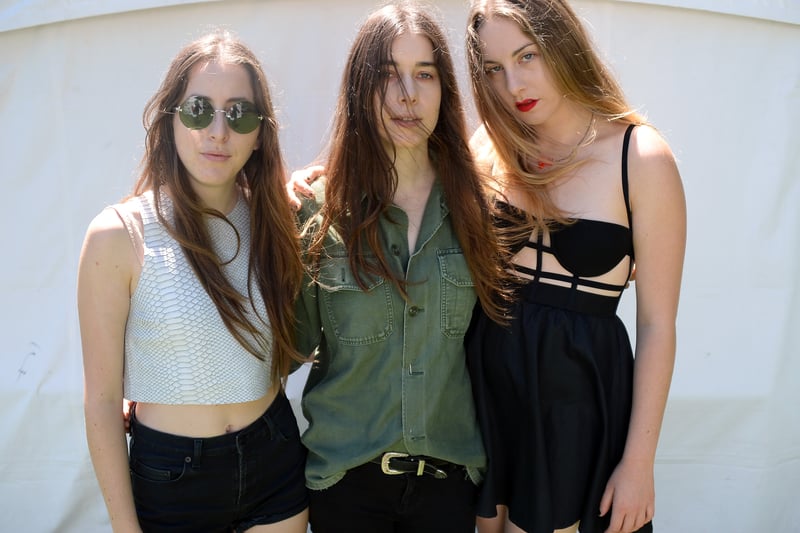 Este, Danielle, and Alana Haim, the sisters behind Haim, blend contemporary pop with classic rock and folk influences, gaining critical acclaim and a dedicated fanbase. Not pictured is the fourth "HAIM Sister" - Taylor Swift.
