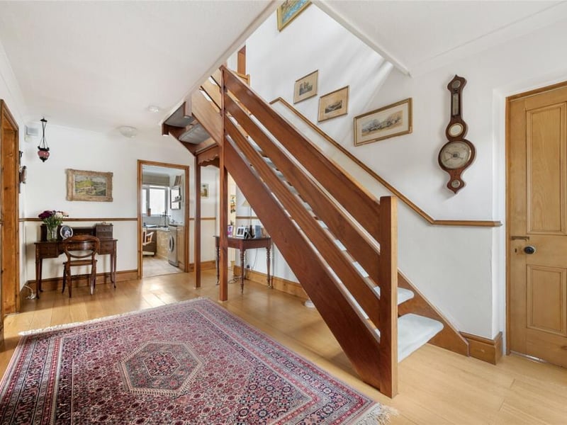 The entrance porch leads into this welcoming hallway with wood effect flooring providing access to all principal rooms.