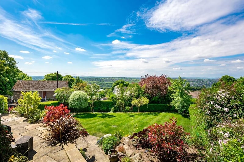 The gorgeous enclosed garden has magnificent views and large lawns with trees and shrubs.