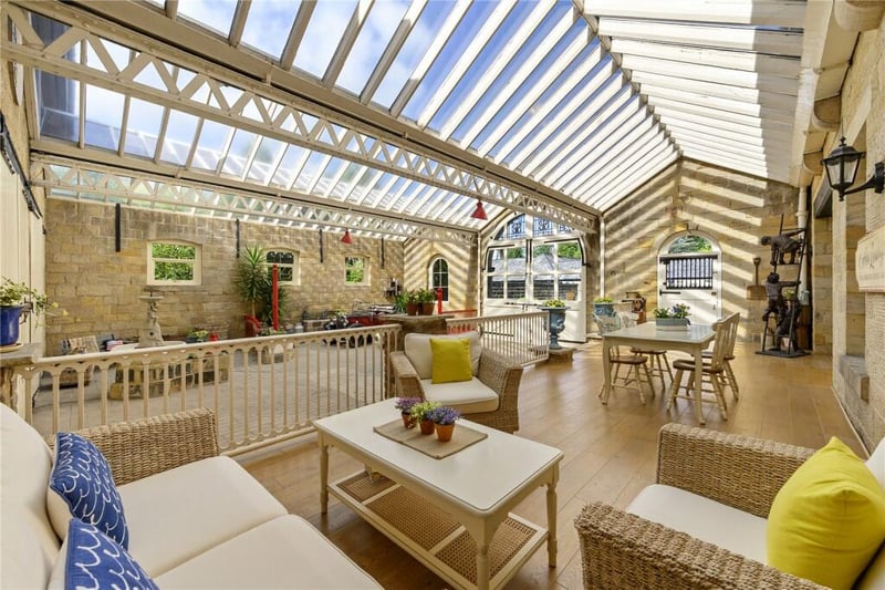 Here are raised decked areas and a courtyard covered by a large glass ceiling.