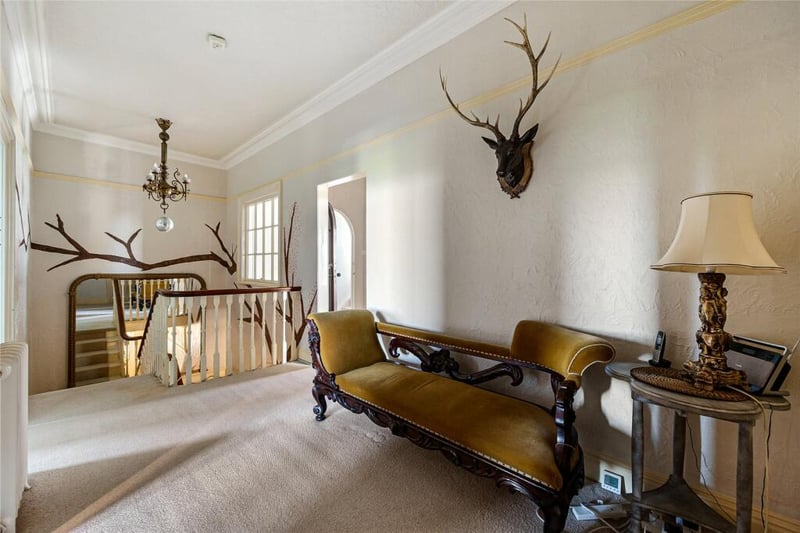 The grand staircase leads to this beautiful galleried landing.