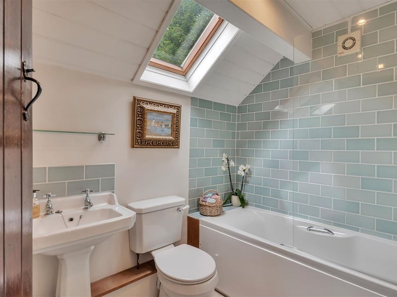 The contemporary bathroom inside the property features pretty fixtures and accessories in keeping with the properties country aesthetic. Picture: Rightmove