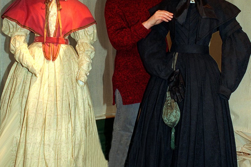 BBC costume coordinator Hilary Swift at the Bronte Parsonage Museum with costumes from  drama  The Tenant of Wildfell Hall  by Anne Bronte . The black brocade dress with matching shoulder cape and bonnet  is the one worn by actress Tara Fitzgerald who portrayed Helen Graham  in the serialisation . Pictured in November 1996.