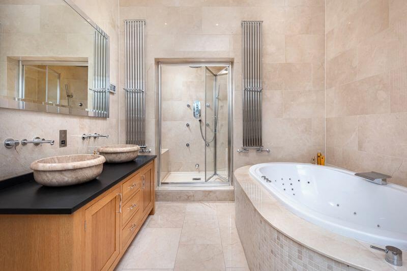 Along with the six ensuite bathrooms, the property has a shower room on the lower level, next to the gym area. There is also a separate water closet on the lower level and one on the property's main floor.