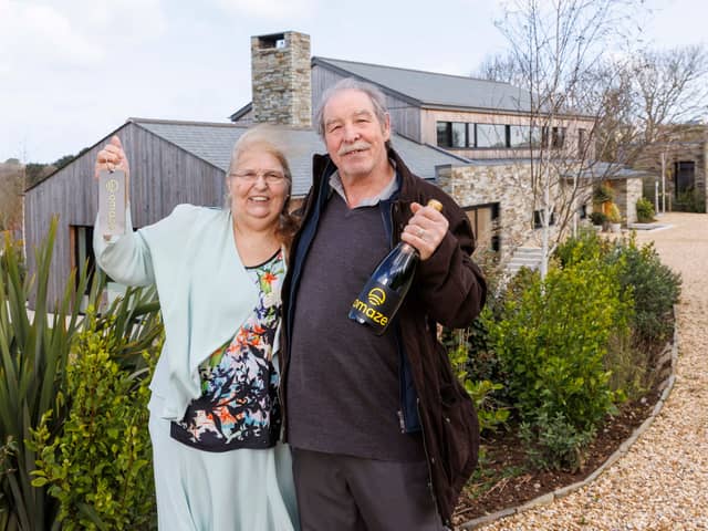 Omaze Million Pound House Draw Cornwall winner Rose Doyle with husband Tony outside their new home. 