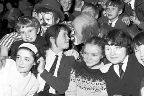 Young folks in in the audience watch on as Brum the clown goes in for a kiss at the Kelvin Hall circus in December 1968.