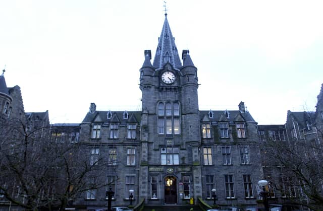 The Victorian facade and clock tower of the old Royal Infirmary building on Lauriston Place, Edinburgh ahead of the hospital's move to Little France.