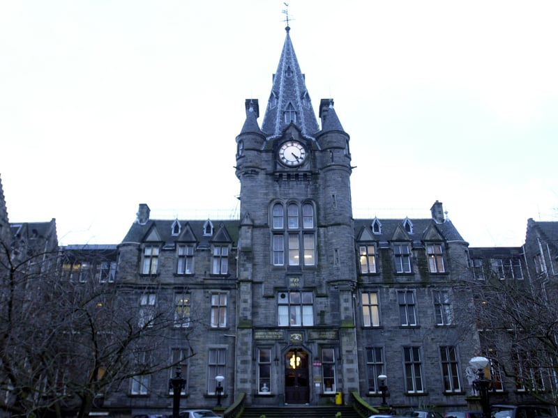 The Victorian facade and clock tower of the old Royal Infirmary building on Lauriston Place, Edinburgh ahead of the hospital's move to Little France.