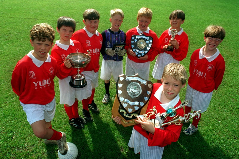 The school's U-10s football team pictured in July 1997 with silverware they had won. Back row, from left, are Joseph Fella, Kieran Phelan, Tony Follon, Dominic Broadley, Michael Somers, Andrew Querishi and Michael Bones. Front is captain Liam Rowland with trophies.