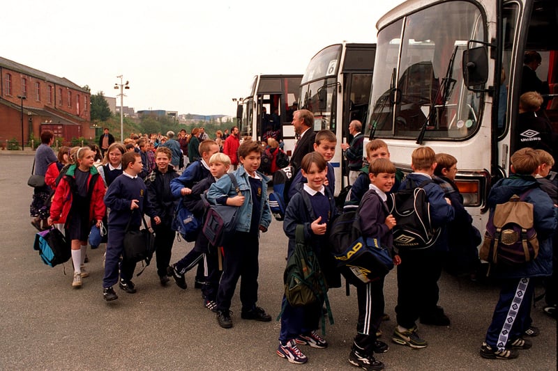 Pupils board coaches at Morley Snooker Centre for the journey to Sharp Lane Primary School in September 1997.