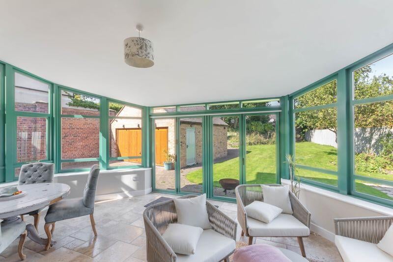 The sun room is the perfect place to chill out in during the summer months, with bi-fold doors leading to the rear garden of the property.