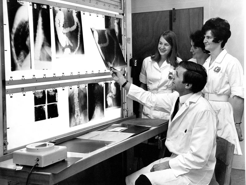 A doctor and nurses examine a patient's X-rays in the viewing room for X-ray film at Edinburgh Royal Infirmary, February 1970.