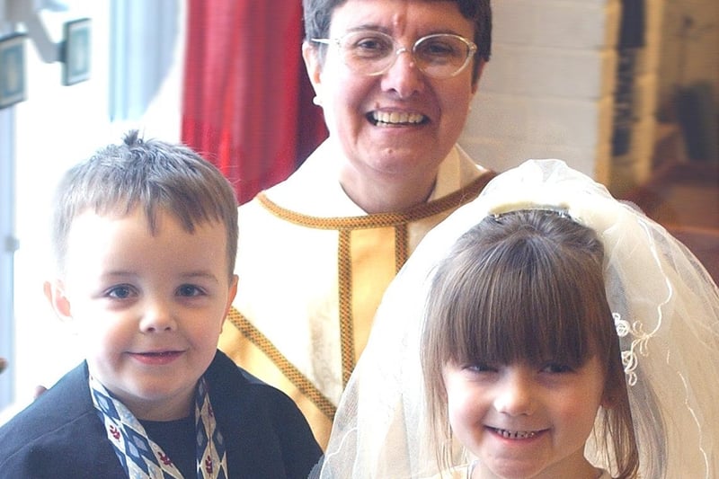 Bethany Morton, four, and Tyler Dolan, three, posed for this post-wedding photo at Oxclose Church in March 2004.
The Priest-In-Charge was Susan Kent.