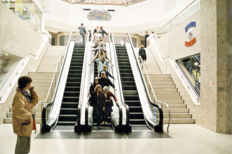 The escalator and stairs in the Centre in September 1999. Sports Soccer Sportswear store on the right.