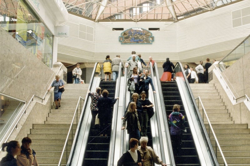 Shoppers using escaltor in St. Johns Shopping Centre. Shows domed glass roof with levels of multi storey car park above. Pictured in September 1999.