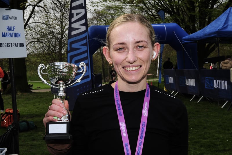 Half marathon winner Emily Coates, from Garforth, with her trophy.