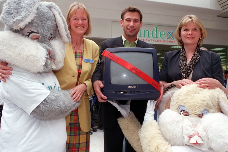 Emmerdale's Paul Opacic presents TV and videos to Wheatfields and St.Gemma's Hospices fundraising managers Alison Wort and Catherine Kay at the opening of the new Index Catalogue shop in  May 1998.