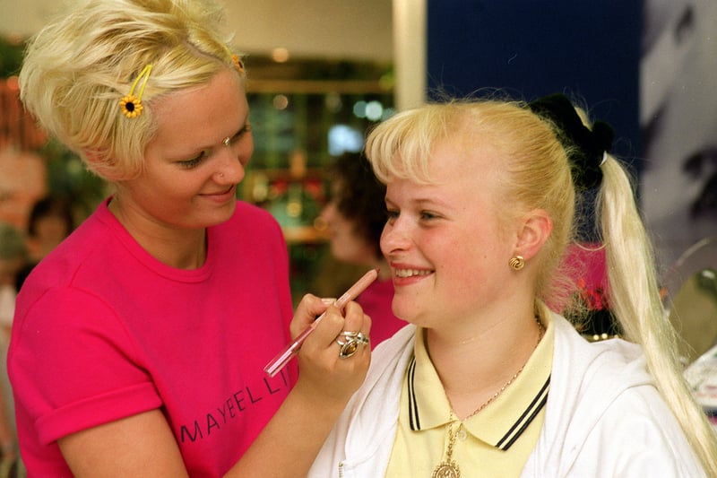 Maybelline make-up artist Emily May, applies lip colouring to Joanne Diclemente during the make up company's visit to the Centre in May 1998.