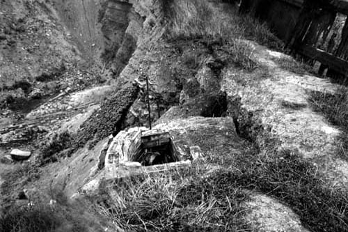 August 1943 and this view looks down into Boyle's quarry from the edge. A large, brick-lined hole is in the foreground.