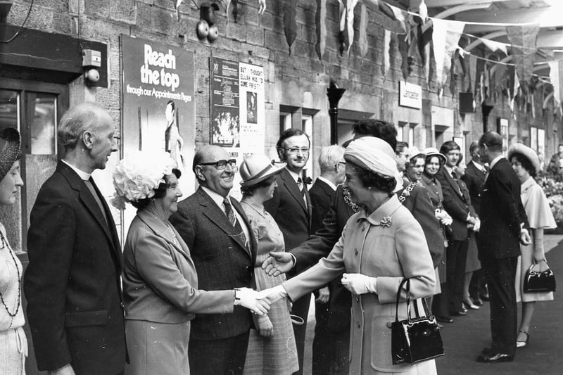 Dignitaries greting the queen at Lancaster Train Station. Councillor Abbot Bryning and Dame Elaine Kellet Bowman are two of the dignitaries in the photograph