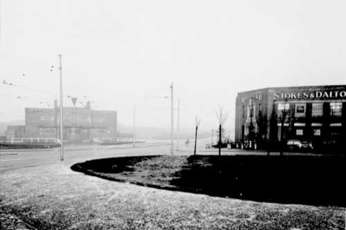 Lupton Avenue in December 1944. A view across island site, looking North towards Eagle Hotel and Stokes and Dalton's Spice Mills. Tramlines are visible, frost covers the ground.