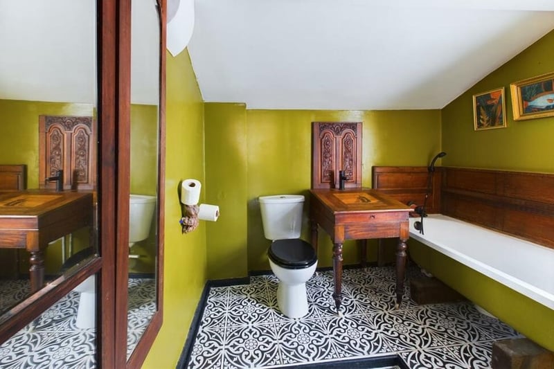 The bathroom is a twist on classic black and white - Parisian-esque.