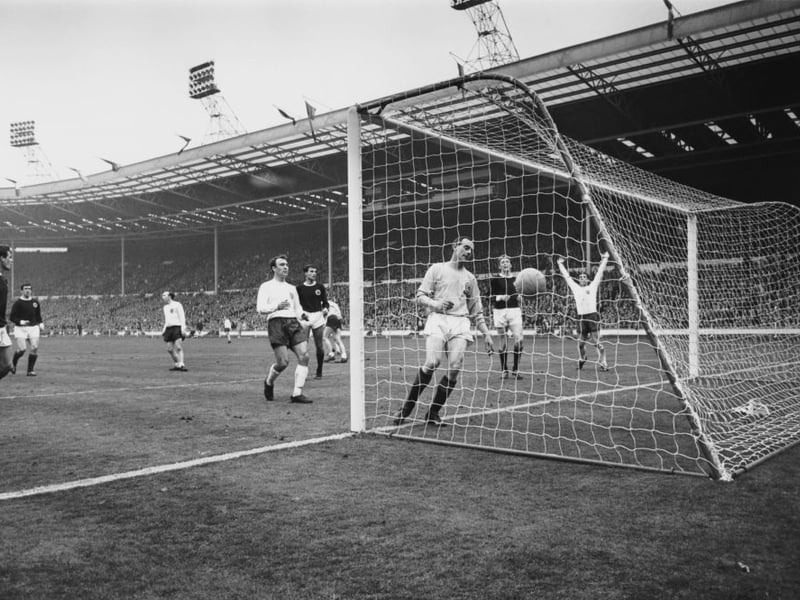 Scottish goalkeeper Ronnie Simpson looks dejected after conceding a late goal from Geoff Hurst reduces the deficit in the 88th minute.