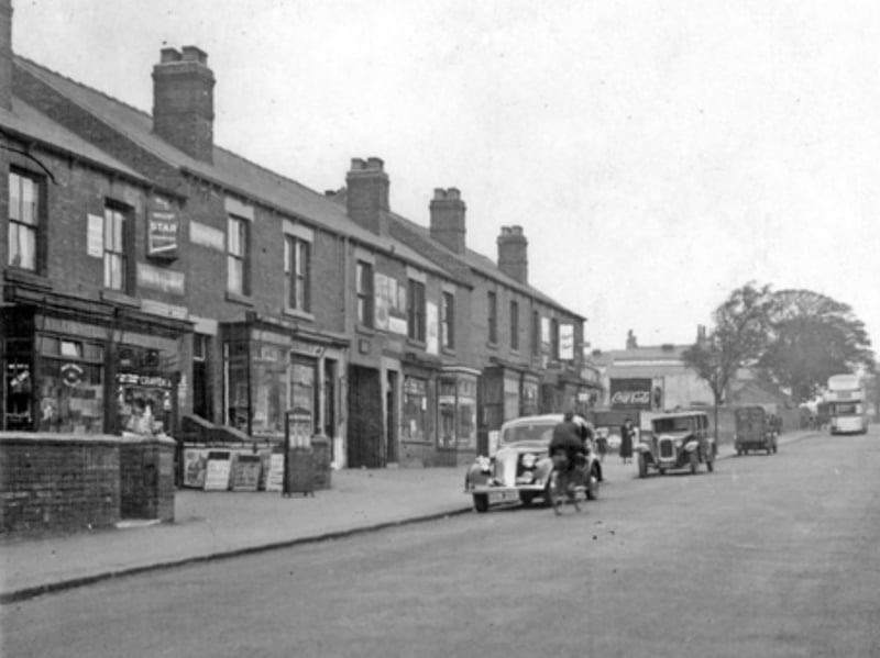 Bellhouse Road looking towards Shiregreen Lane some time between 1920 and 1939. The row of shops (including Henthorne's newsagent) was called Victoria Terrace