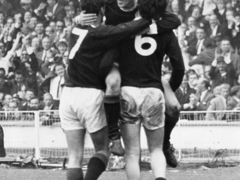 Bobby Lennox is congratulated by team mates Willie Wallace (left) and Jim Baxter after scoring Scotland's second goal at Wembley in the 78th minute.
