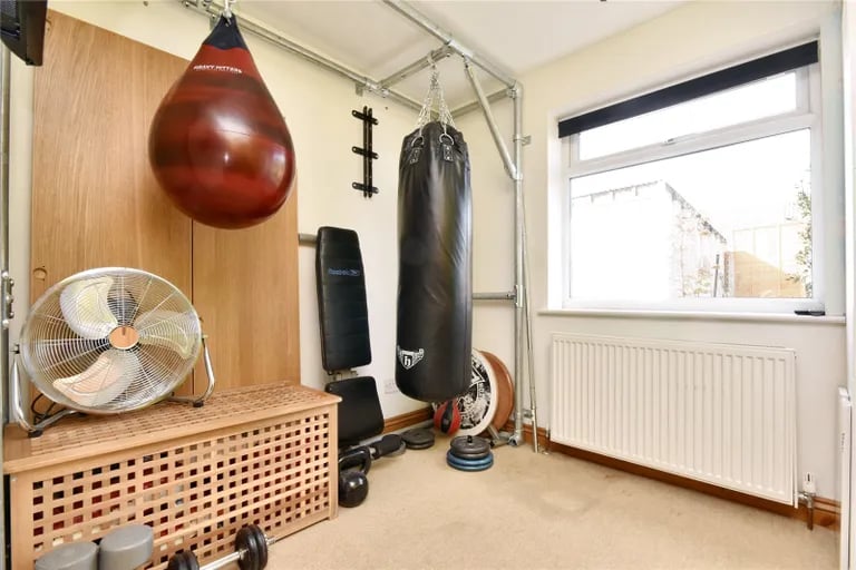 The third bedroom is currently used as a home gym.