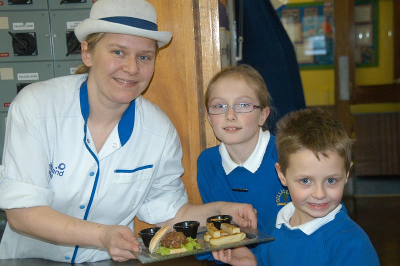 Pupils Courteney Wilson and Daniel Hughes were looking forward to their dinner, served by school cook Joanne Keighley at Gillas Lane Primary in January 2010.