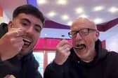 Callum Ryan and his dad Darren Ryan trying 'London's hottest curry' at Aladin in Brick Lane.