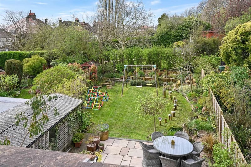 Along with the spacious patio, the enclosed rear garden feautres a good-size lawn, planted borders and play area.