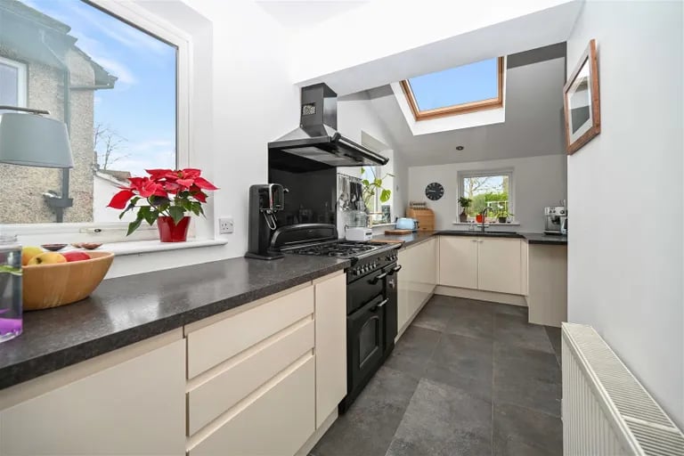 On the opposite end of the hallway is this high quality fitted kitchen.