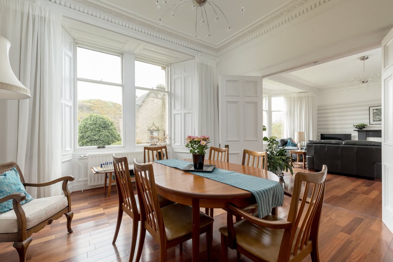 Folding double doors in the sitting room allow full access to a south facing bay-windowed dining room, again with similar cornicing. 