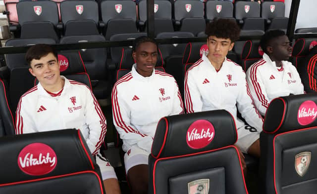 Harry Amass, Habeeb Ogunneye, Ethan Wheatley and Omari Forson sit on the bench ahead of the Premier League match between AFC Bournemouth and Manchester United