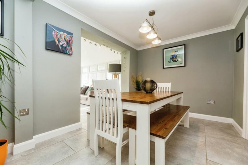 A generously sized dining area, opening out into the sun room, kitchen and living room creating a great social/entertaining space, complete with porcelain floor tiling with under floor heating, wall mounted vertical grey radiator and uPVC French doors opening out directly onto the garden.