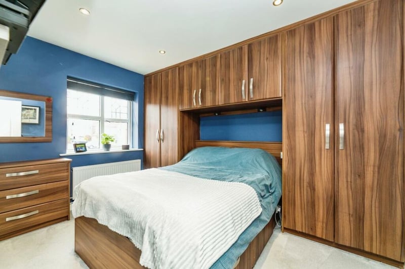 A good sized double bedroom hosting an array of light wood fitted wardrobes, inset spotlights, wall mounted radiator and front facing uPVC window. Door leads to ensuite shower room.