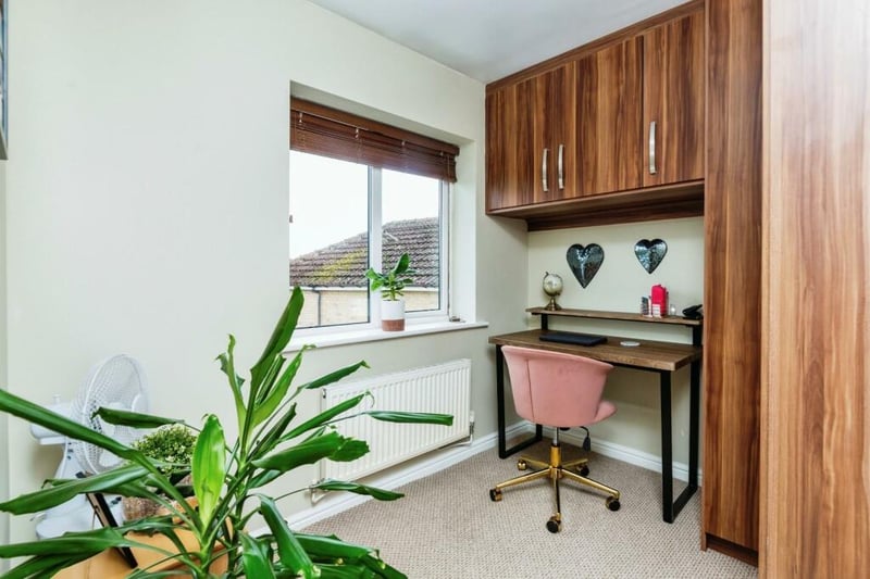 Currently used as a second home office, but could be used as a large single bedroom or nursery if desired, hosting dark wood fitted wardrobes, wall mounted radiators and rear facing uPVC window.
