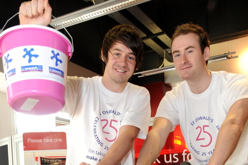 Kieren Jennings and Jonny Small, right, got on the exercise bikes for charity at the Market Square branch of HSBC.