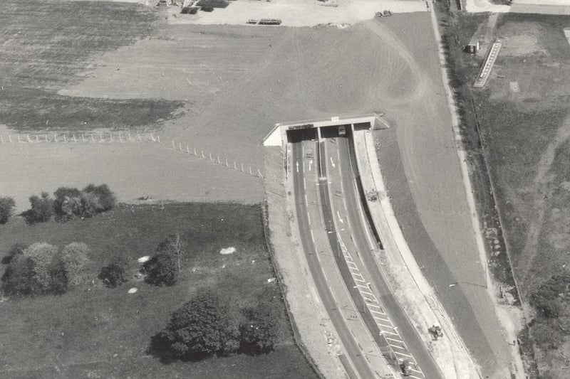 The main A658 Harrogate Road was diverted as it passes Leeds Bradford Airport beneath a tunnel; the runway extension passes over the tunnel. Pictured in June 1984.